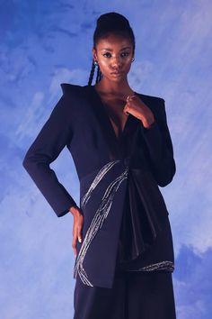 Navy blue structured and asymmetric blazer, elevated with placement geometric embroidery using crystals, aari, zardozi work and a drape cascading from the front buttons. - Aza Fashions Designer Festive Evening Outerwear, Festive Tailored Blazer For Evening, Festive Evening Embellished Blazer, Festive Embellished Evening Blazer, Designer Embellished Evening Blazer, Luxury Outerwear For Night Out, Designer Blue Blazer For Party, Designer Blue Party Blazer, Asymmetric Blazer