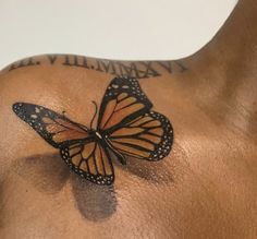 a man with a butterfly tattoo on his chest