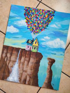 a painting of a house on the edge of a cliff with a waterfall and colorful hot air balloons floating over it