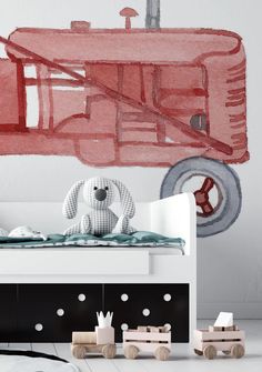 a child's bedroom with a red fire truck painted on the wall