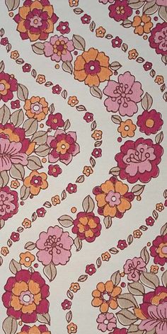 an orange, pink and brown floral print fabric