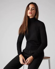 Envelop yourself in N.Peal Superfine - here in a roll neck cashmere sweater. Made from 100% Mongolian Cashmere. Available in Black. Receive complimentary delivery and bespoke wrapping on all orders.