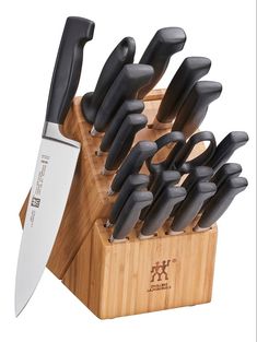 a knife holder with many knives in it