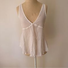 Nwot. Never Worn. Brand New. Super Cute Lightweight Flouncy Tank Made Out Of Gauzy Type Material. Cute With Lace Or Chain Bra Underneath Sheer V-neck Top For Vacation, Feminine White Tops For Loungewear, Chic Unlined Top For Daywear, White Sheer Tops For Daywear, White Sheer Tops For Day Wear, Unlined Summer Tops, Unlined Summer Daywear Tops, Unlined Summer Tops For Daywear, Chic White Tank Top For Loungewear