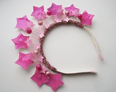 Pink  star crown for girls or women.  This headband with handmade pink stars adds beautiful sparkle to any daily outfit, special occasions and Christmas celebrations. It is attached to hard silver headband. This headband fits 2 and up. They are also great for BIRTHDAY GIFT. All items are handmade with attention to detail in a smoke free environment. Many other stiles and colors of cute hair clips, headbands, shiny crowns on my shop  https://www.etsy.com/shop/PinkandBright . Take a peek! Thank yo Ladybug Headband, Stars Headband, Red Flower Headband, Crown Women, Crown Headdress, Star Crown, Crown Headpiece, Star Birthday, Halo Headband