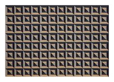 a black and beige rug with geometric design