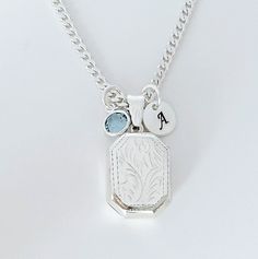 "Solid Sterling silver Locket Rectangle Necklace-  This piece will be a treasured keepsake! They're not only a trendy, stylish accessory, but also boast a rich and fascinating history.  This locket has a little bit of rim on both sides to hold two pictures in place without any glue!  The chains and Lockets I offer are solid 925 Sterling Silver Italy made, not silver or gold plated. . Take a look at other Locket designs: http://etsy.me/XKqYt8 . DESCRIPTION:  . Solid 925 Sterling silver Locket size:  20 mm L x 15 mm. . Sterling Silver disc 8mm with your chosen initial or heart 7mm upon request. . Swarovski birthstone of your choice month. . 925 Sterling Silver Italian Chains. I recommend curb chain for lockets!!   Need initials, charms, etc,? this link: http://etsy.me/UFmfXa . LOCKETS BY SHA Cheap Adjustable Silver Locket Necklace, Rectangular Charm Necklaces As Gift, Jewelry With Detachable Square Pendant For Gifts, Sterling Silver Engraved Square Pendant, Engraved Sterling Silver Square Pendant Jewelry, Engraved Sterling Silver Square Pendant, Personalized Silver Elegant Charms, Elegant Personalized Silver Charms, White Gold Rectangular Pendant For Wedding