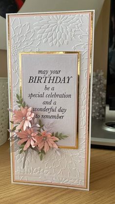 a birthday card with flowers on it