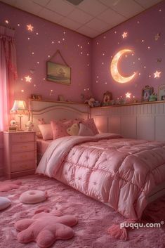 a bedroom decorated in pink with stars and moon decals