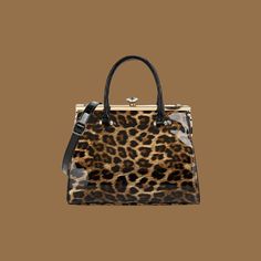 "The City Kitty" Patent Leather Luxury Handbag Leopard print Frame Satchel Designer Bag Rhinestone Clasp Women's Purses Gift Ideas Elegant Purse Casual This classy bag is perfect for everyday or add it to your fall/winter style.  Elegant evening or casual day, chic quality craftsmanship. Dress up for a wedding or party and sport this sharp accessory to your stylish look.  This handbag has plenty of space and an extra pocket inside for more organization. Like all our bags it comes with a strap to go from handbag to shoulder bag.  You are sure to be complimented with this bag everywhere you go. 13"Wx10"Hx 5.5"D Push lock closed , fabric lining Four protective feet at base Handles with 7" drop, with Adjustable Detachable strap with 23" drop for shoulder or crossbody wear Inside 2 open pockets Women's Purses, Elegant Purse, Leopard Print Handbags, Purse Casual, Fall Winter Style, Purse Gift, Luxury Women Fashion, Print Frame, Designer Bag