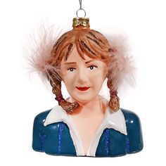 a figurine of a woman wearing a blue dress with feathers on her head