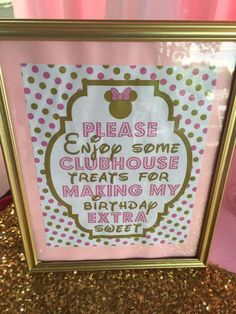 a pink and gold framed sign with minnie mouse on it