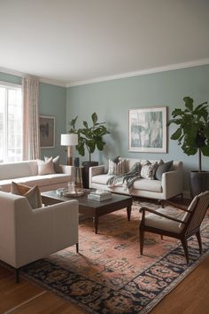 a living room filled with furniture and a rug on top of a hard wood floor