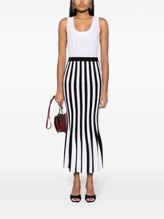 Find MOSCHINO Striped Knitted Midi Skirt on Editorialist. black/white knitted construction vertical stripe pattern slip-on style high-waisted ribbed elasticated waistband fluted hem mid-length Chic Striped Stretch Skirt, Black Pin Stripe Midi Skirt, Black And White Striped Maxi Skirt, Knitted Midi Skirt, Zebra Print Knitted Skirt, Moschino Piano Skirt, Black Midi Skirt, Mid Length, Stripes Pattern