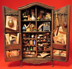 an old wooden cabinet filled with lots of items