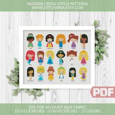 the princesses cross stitch pattern is displayed on a white wooden background with green leaves