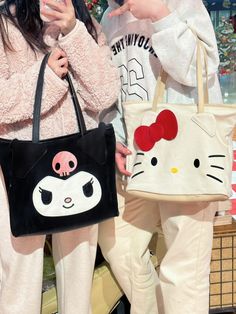 Kitty & Kuro Tote Bag This adorable Kitty & Kuro tote bag is a must-have for any kawaii lover. Its spacious design and durable material make it perfect for carrying all your essentials. Show off your cute style with this charming accessory! Size： Shoulder strap length: 38cmBag length: 32cmHeight: 29cmWidth:12cm Main material: canvas and leather Hello Kitty Kuromi, Sanrio Japan, Plush Backpack, Your Cute, Cute Style, Cute Cats, Hello Kitty, Shoulder Strap, Kitty