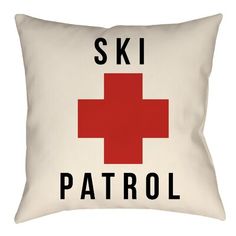 a white pillow with a red cross on the front and ski patrol written across it