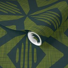 a green and black wallpaper with an abstract design on it's surface,