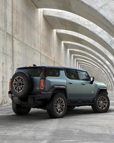 the jeep is parked in an empty tunnel