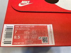 a red box with a white nike air streak lite label on the front and side