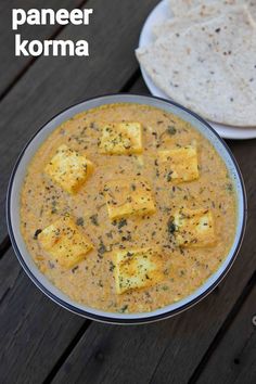 paneer korma served in a bowl with tortilla bread on the side