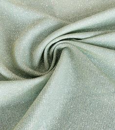 a close up shot of a light green fabric