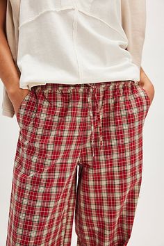 Perfect in plaid, these exclusive trousers from Damson Madder will turn heads from this season to the next. **Fit:** Mid-rise, relaxed wide-leg silhouette **Features:** Pull-on design, drawstring at waist, signature embroidered initials at back, side pockets **Why We ❤ It:** Toughened up with moto boots or off-duty with sneakers, this pair has endless ways to wear. | FP x Damson Madder Chlo Trousers at Free People in Red, Size: US 10 Damson Madder, Red Plaid Pants, Plaid Pajama Pants, Denim Cargo Pants, Embroidered Initials, Plaid Pajamas, Red Boots, Brown Plaid, Plaid Pants