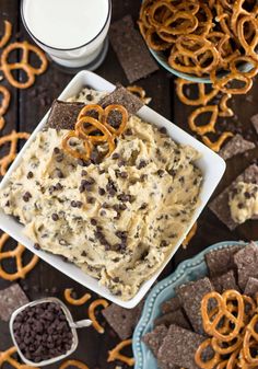 chocolate chip cookie dough dip with pretzels and pretzel crackers on the side