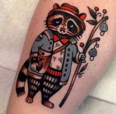 a raccoon with a hat, vest and bow tie holding a stick on his arm