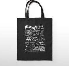 a black tote bag with the words midnight written on it and images of monsters