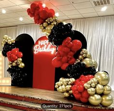 balloons and streamers decorate the entrance to a birthday party