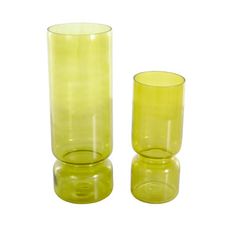 two yellow glass vases sitting next to each other