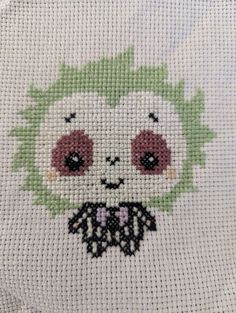 the cross stitch pattern has been made to look like an animal