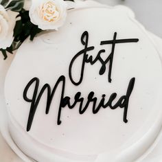 a white cake with the words just married written on it