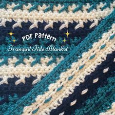 the crocheted afghan is blue, white and green with stars on it's side