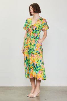 A color palette of mood-boosting brights enlivens this floral-printed midi dress. Framed by voluminous bubble sleeves, it's got a V-shaped neckline with tie detailing that lets you adjust the fit of the bodice. •V-shaped neckline •Adjustable tie detailing •Short bubble sleeves •Elasticized back waist •Mid-length hem Item Number: 99794 Spring Floral Print Mid-length Puff Sleeve Dress, Spring Mid-length Puff Sleeve Dress With Floral Print, Vibrant Multicolor Print Midi Dress For Spring, Multicolor Puff Sleeve Dress For Spring, Multicolor Vibrant Print Midi Dress For Garden Party, Multicolor Print Midi Dress For Vacation, Multicolor Midi Dress With Vibrant Print For Garden Party, Spring V-neck Midi Dress With Vibrant Print, Multicolor Floral Print Knee-length Midi Dress