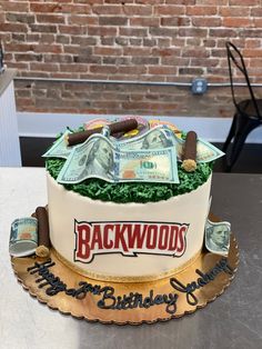 a birthday cake decorated with money and cigars