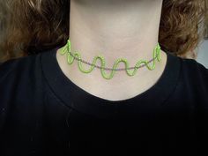 A choker necklace made with silver chain and green seed beads. Creates a wavy effect that adds a fun touch to any outfit! Trendy Festival Beaded Chain Choker, Green Adjustable Chain Necklace For Party, Trendy Handmade Green Necklaces, Trendy Green Necklace For Party, Green Choker Necklace With Adjustable Chain, Green Chain Jewelry For Festivals, Green Chain Jewelry For Festival, Green Tiny Beads Choker For Festivals, Trendy Green Chain Necklace With Adjustable Chain