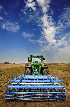 a tractor is parked in the middle of a field