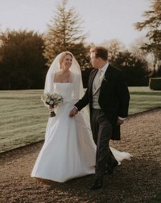 the bride and groom are walking together