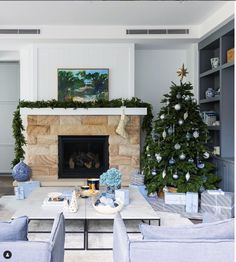 the living room is decorated for christmas with blue and white decor