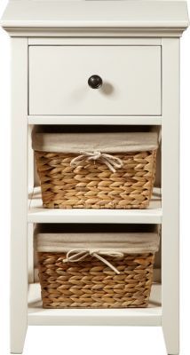 two wicker baskets sit on top of an end table with one drawer open and the other closed