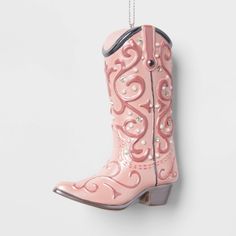 Add a touch of country flair to your holiday tree with this Cowboy Boot Christmas Tree Ornament from Wondershop™. This hanging ornament is a 4-inch-tall cowboy boot in glossy pink with a floral pattern, white dots, sparkly silver rhinestones, curved topline and a gray heel, designed to lasso in festive cheer. Made from resin, it also comes with a silver top loop for easy hanging from the branches of your tree. Welcome to the Wondershop™. Donut Christmas Tree, Pink Cowboy Boot, Pink Cowboy Boots, Christmas Shopping List, Target Christmas, Candy Cane Christmas Tree, Pink Cowboy, Target Holiday, Retro Christmas Tree