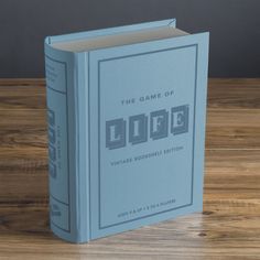 a blue book sitting on top of a wooden table