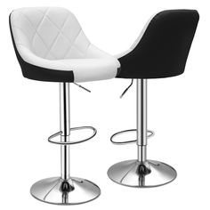 two black and white bar stools with footrests on the bottom one has a quilted seat