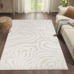 a large white rug in a living room