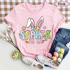 a pink shirt that says sophia with bunny ears and flowers on the front