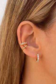 The Divya are huggie hoop earrings with baguette-cut cubic zirconias. These dainty, modern, minimalist-style earrings can be worn daily as well as on special occasions. They look great when worn on the first and second holes as well as on cartilage piercings. Perfect for a gift! Features: * Inner diameter: 10 mm. * Outer diameter: 13.5 mm. * They are sold in singles and pairs. Both options are available on the dropdown menu. * All of our jewelry is made of sterling silver (925 mm), and our gold Single Ear Piercing, Earring Inspo, Cartilage Piercings, Ear Piercing, Cartilage Piercing, Baguette Cut, Huggie Hoop Earrings, Style Earrings, Minimalist Style