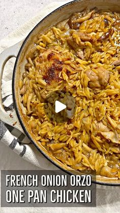 a pan filled with chicken and rice on top of a table